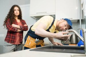 Plumber Fixing Kitchen Sink Smell